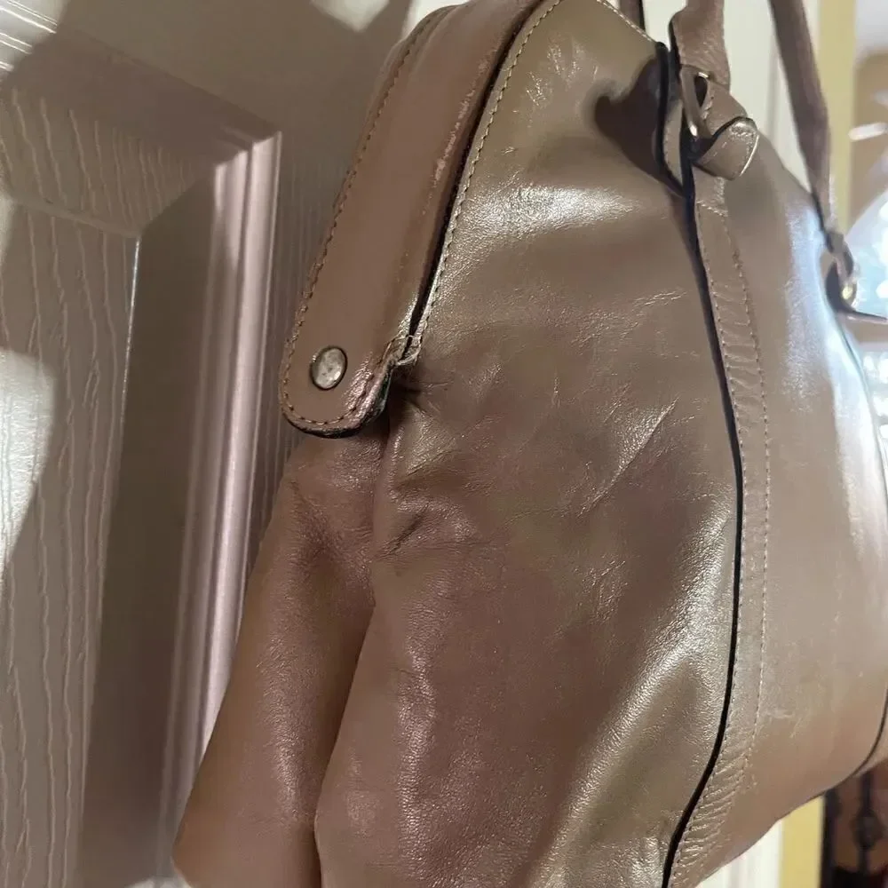 Tano Leather tan frame medium satchel gold tone hardwares .